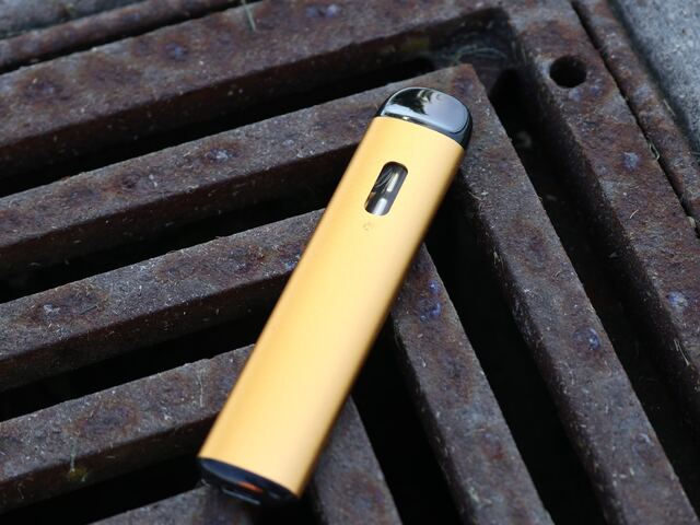 cbd vape device on metal bars